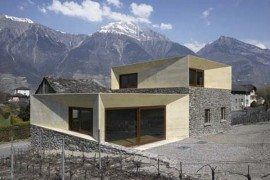 ex-farmhouse with eclectic concrete and stone appearance