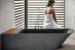Lovely stone bathtub displaying clean modern lines