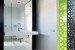 Dark-cladded facade sheltering bright interiors: Lily Street House