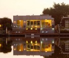 wooden house on the lake shore