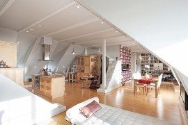 Stockholm Attic Apartment Charms with Its Steep Ceilings