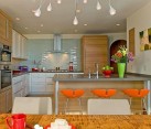 Sleek modern kitchen with neon colors and modern bar stools