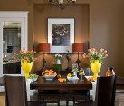 A colorful dining table setup in a soothing brown dining room