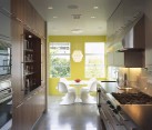 ultra modern kitchen with yellow wall contrast
