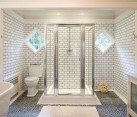 white bathroom with grey tile grout