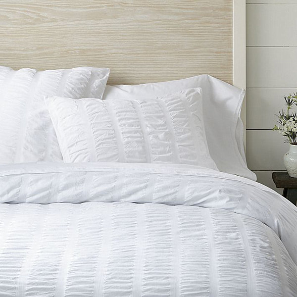 ... Cover + Shams in white. Puckered bedding has never been so clean and