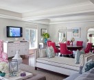 white traditional living room with pink accesory furniture