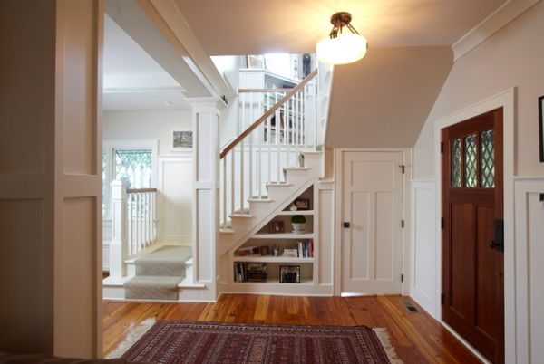 Ample shelf space under a modern staircase