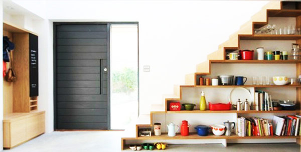 Fashionable shelves under stairs showcase well defined lines