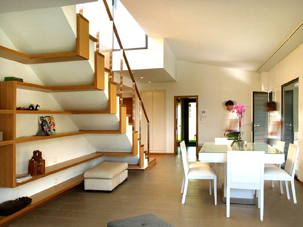 Gorgeous staircase with sleek and flowing shelves underneath