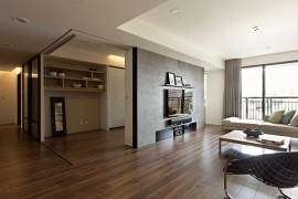 Modern apartment with retractable glass walls for home office area