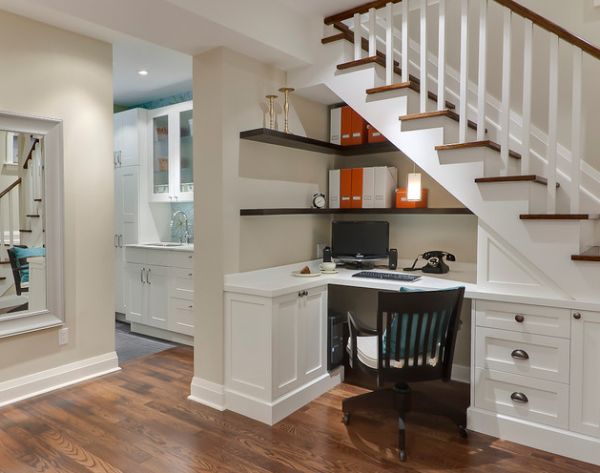 Use the space under the stairs to sport compact home office shelves