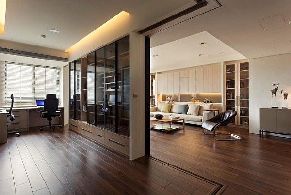 Modern apartment with retractable glass walls for home office area