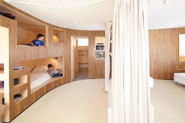 Cabin in the French Alps Gets Functional Curved Wooden Wall