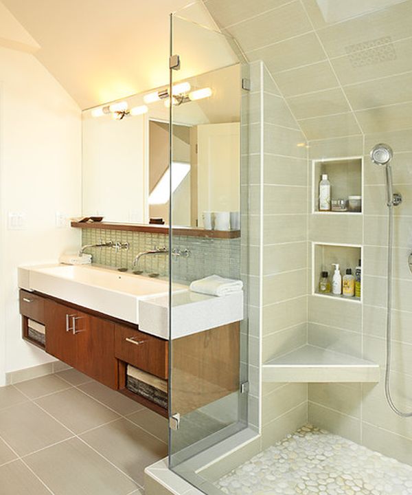  floating sink cabinet set in a contemporary bathroom clad in glass
