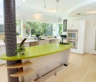 Custom built kitchen island with glossy green counter
