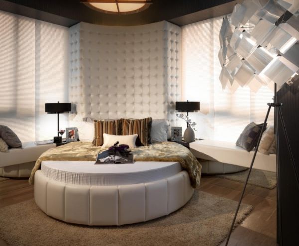 Antique decor and a round bed combine to create a modern bedroom