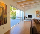 Fabulous track lighting installations give a wavy look to this living space