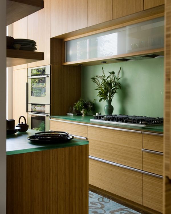 Glass cabinets set in a largely bamboo dominated kitchen!
