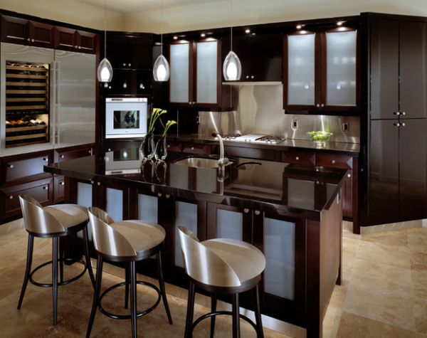 Gorgeous contemporary kitchen in dark hues brings in light, airy appeal with frosted glass door cabinets