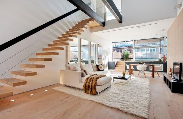 Moderna sala de estar con escalera flotante con estilo