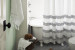 Navy blue and white shower curtain with ruffled trim