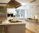 Ergonomic contemporary kitchen in white with a stylish corner sink