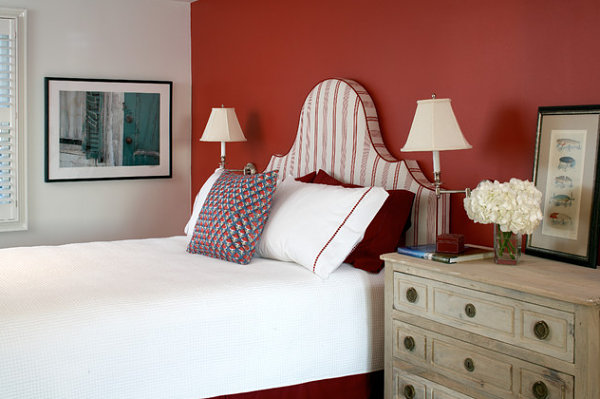 Red accent wall in a crisp bedroom - Decoist