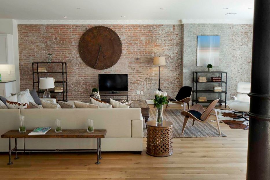 living room with brick wall