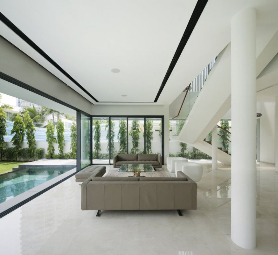 Living room along with the swimming pool Wind Vault House: Exceptional Façade Meets Exclusive Interiors