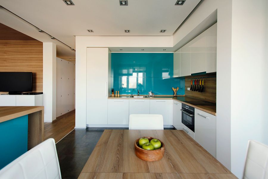 Chic moscow apartment blends minimalism with cool pops of blue