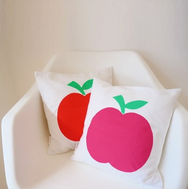 Apple cushions in a modern chair