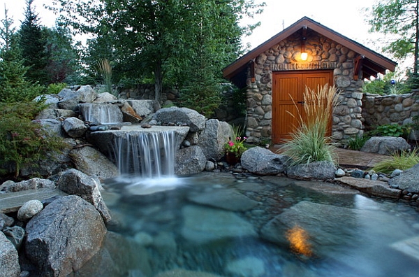 Magical outdoor space with a pool waterfall