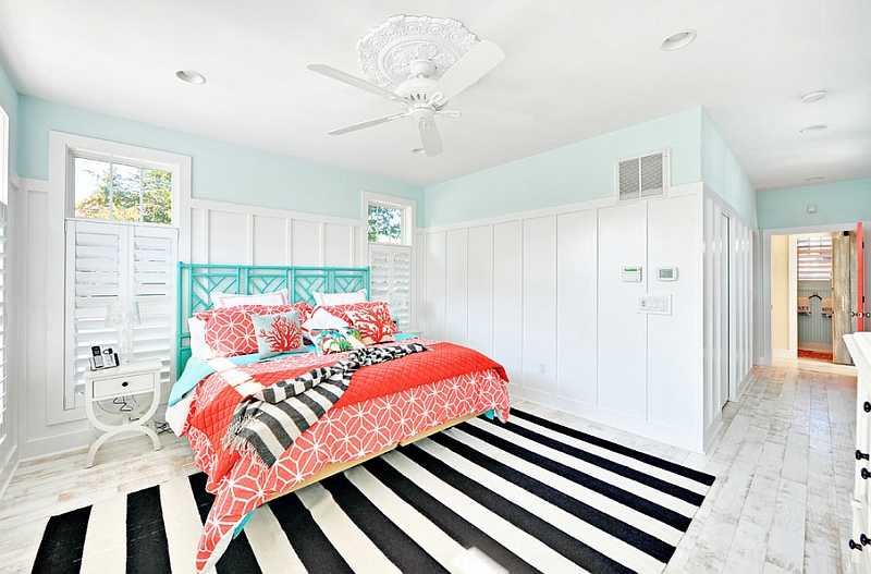 Beach-style-bedroom-with-a-striped-rug-and-fabulous-coral-and-aqua-accents.jpg