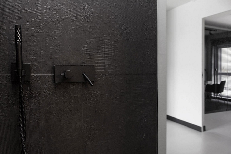 Black tiles with intricate, modern pattern in the contemporary bath