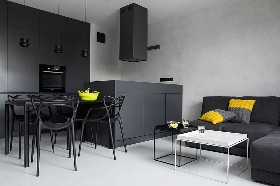 Refreshing pops of yellow and green appear far more prominently when placed against a black and white backdrop Small Black And White Apartment In Poland Exudes Refined Minimalism