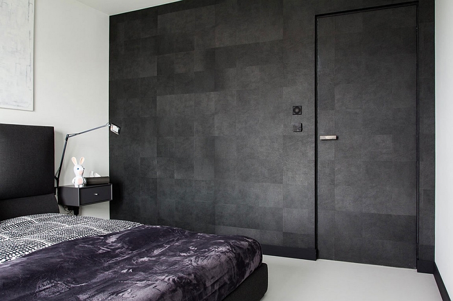 Textured wall in the bedroom offers much needed contrast in the two-color palette bedroom