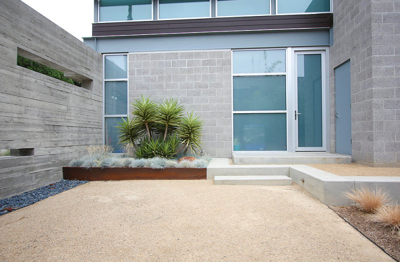 Manicured outdoor space with gravel and pathways Your Backyard Landscaping Strategy: Manicured Or Untamed?