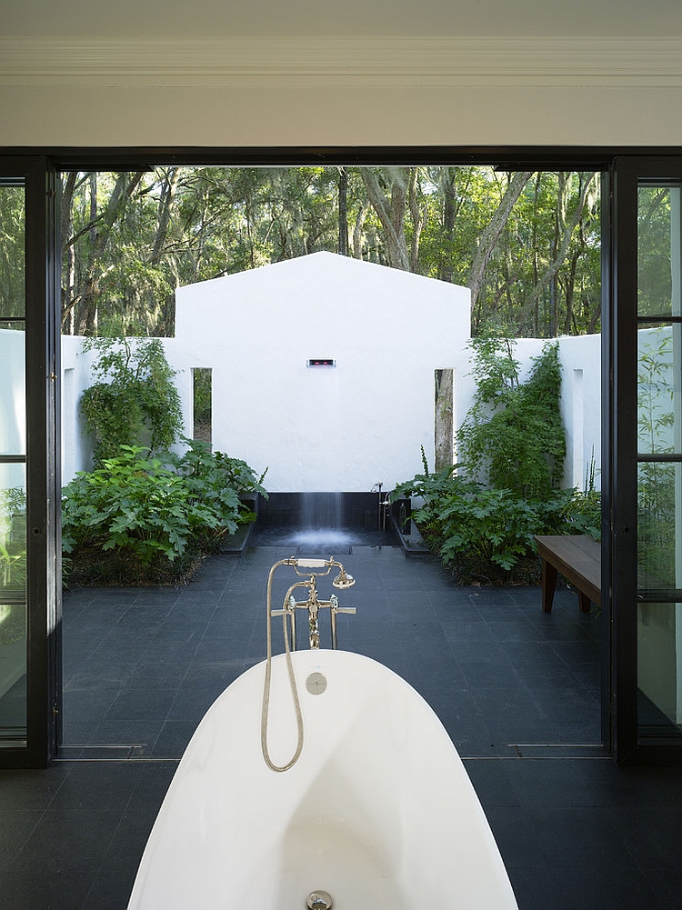 Amazing indoor-outdoor bathroom with shower and bathtub [Design: Summerour Architects]