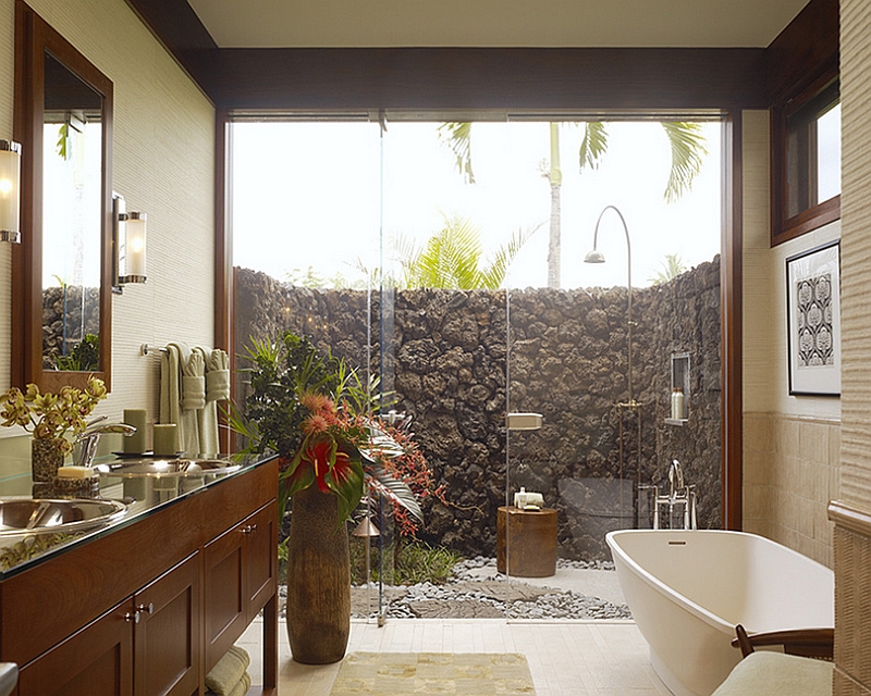 Extend the indoor bathroom outside with a glass wall shower area [Design: Slifer Designs]