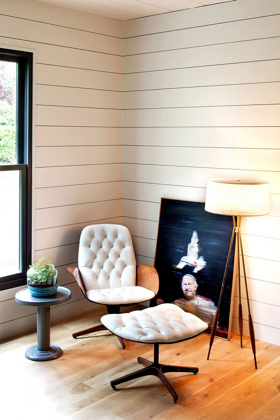 Vintage chair in the corner shapes a cozy reading nook
