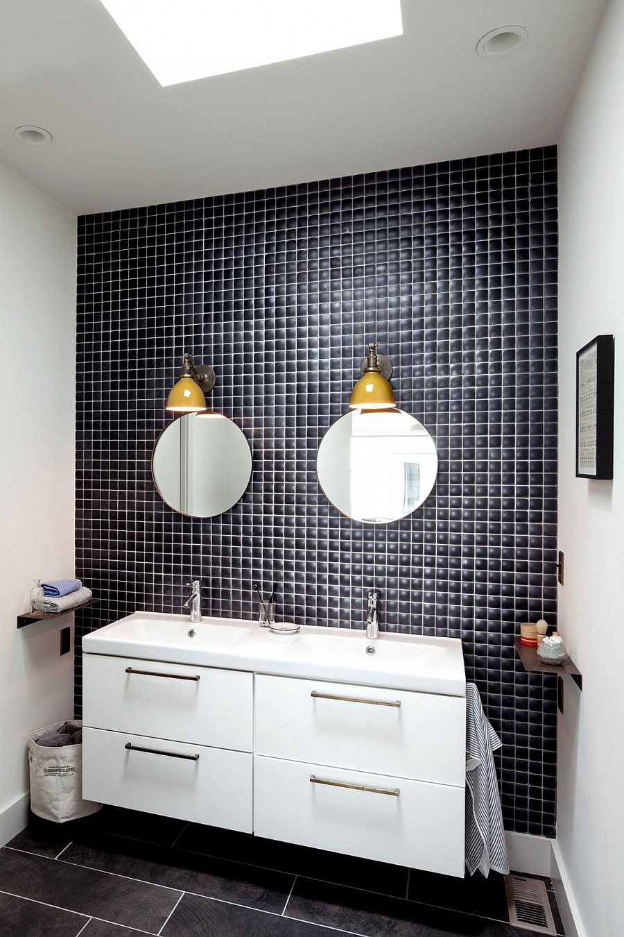 Yellow lighting fixtures bring color into the bathroom