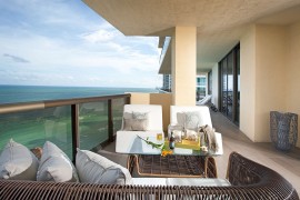 Carefully curated decor fill the porch overlooking the Atlantic