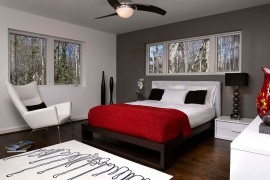 Dark gray accent wall and pops of black anchor the lovely room