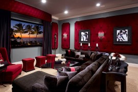 Dashing tufted wall panels in red for the elegant home theater