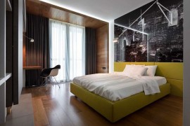 Exquisite bedroom with an exciting bed in yellow
