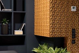 Fireplace surrounded by the 3D carved wooden panels becomes the focal point of the room