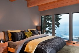 Gorgeous bedroom in gray with stunning view of the Pacific