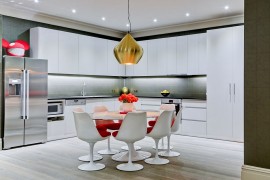 Large Beat Stout Pendant from Tom Dixon adds metallic glint to the kitchen and dining space