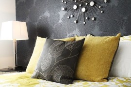 Mirror above the bed adds glamour to the room